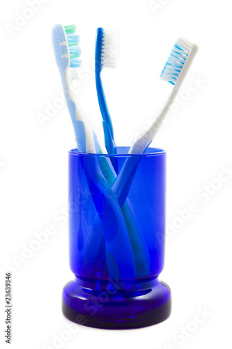 Glass with tooth brushes