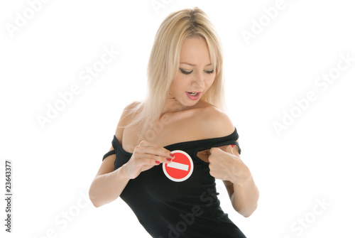 Canvas Print Woman undresses and holds prohibiting sign