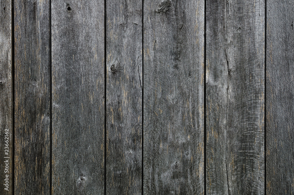 Black painted weathered wooden fence texture