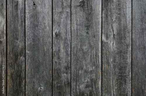 Black painted weathered wooden fence texture