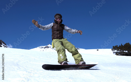 young woman on a snowboard in a mountains
