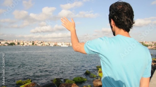 man shake hand by the sea side photo