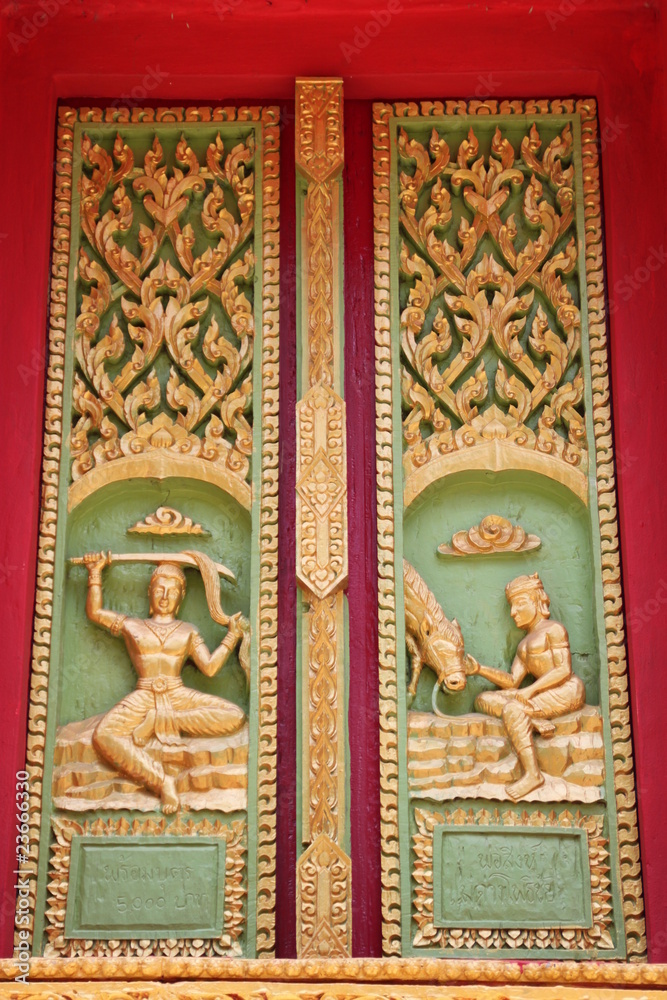 buddhist art on door of temple, Wat Ku Ka Singh, Roi-Et