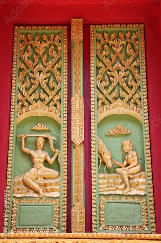 buddhist art on door of temple, Wat Ku Ka Singh, Roi-Et