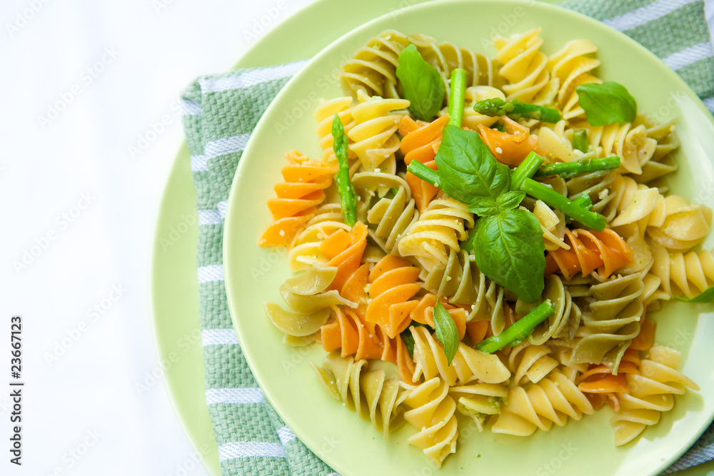 Colorful pasta with asparagus, rocket pesto and basil Colorful pasta with asparagus, rocket pesto and basil