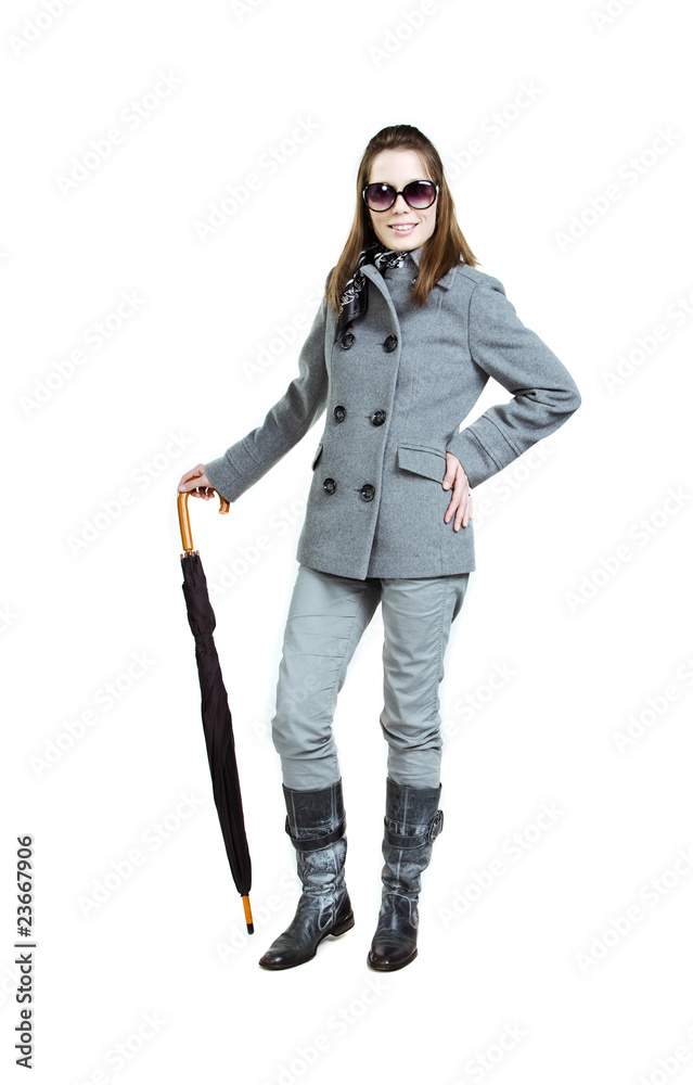 Fashionable girl in an autumn coat with umbrella Fashionable girl in an autumn coat with umbrella