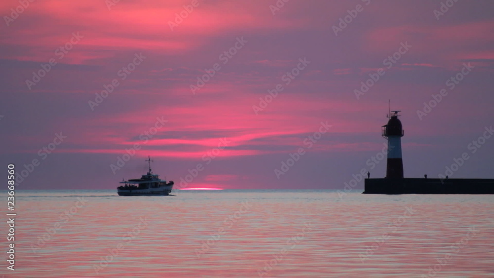 Lighthouse over in cove at sunset. Lighthouse over in cove at sunset.