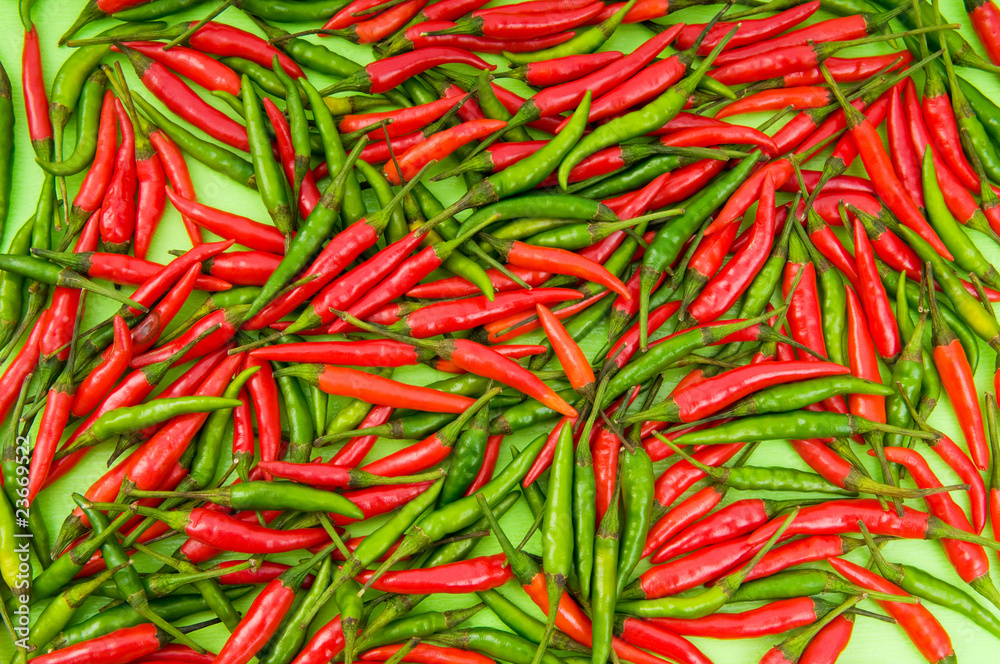 Background made of green and red peppers Background made of green and red peppers