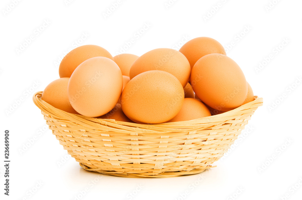Brown eggs in the basket on white Brown eggs in the basket on white