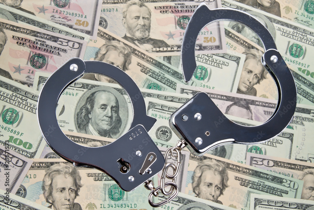 Dollar Geldscheine mit Handschellen Dollar Geldscheine mit Handschellen