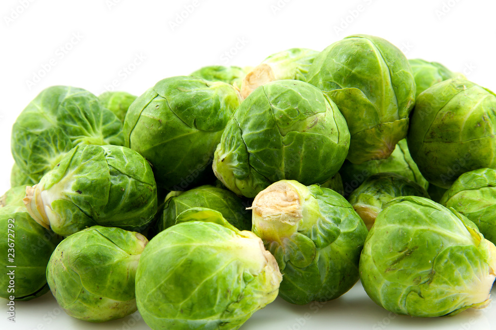 Brussels sprouts in closeup over white background Brussels sprouts in closeup over white background