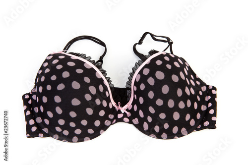 black bra with pink dots over white background