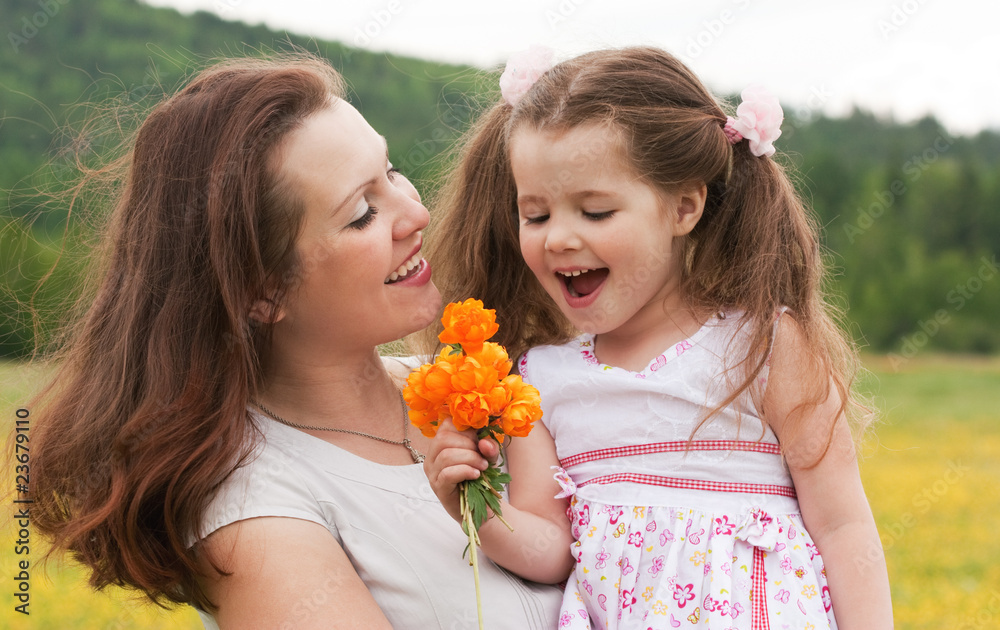 Mum with a daughter on the nature