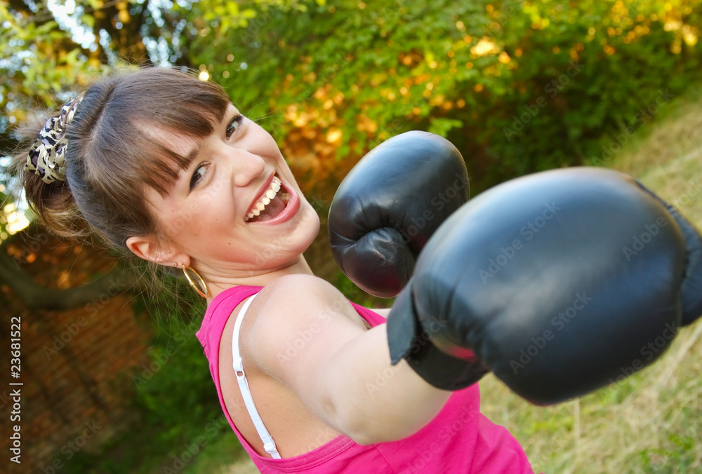 merry girl in boxing-gloves on nature merry girl in boxing-gloves on nature