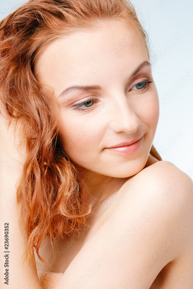 Young woman drying wet hair