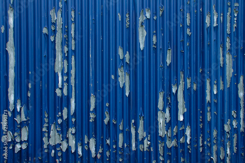 Peeled blue metal fence