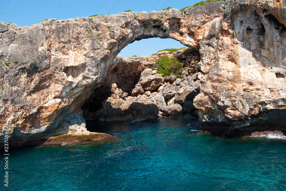 Natural arch and the grotto at Cala Antena, Majorca, Spain