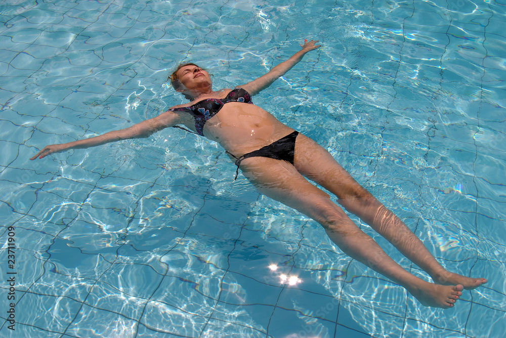 Woman Relaxing in Swimming  Pool
