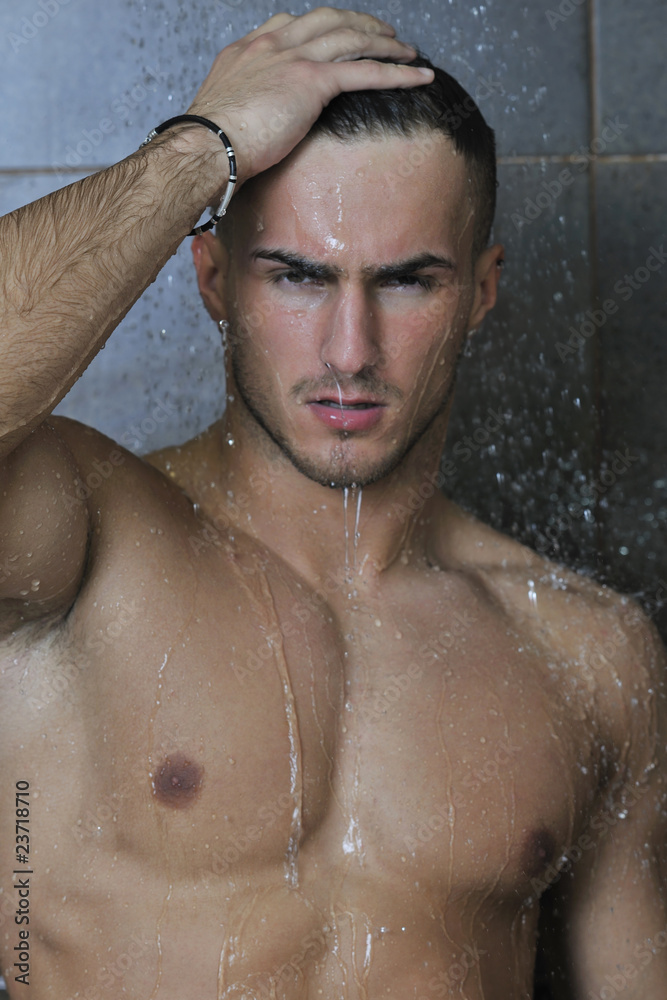 good looking man under man shower good looking man under man shower