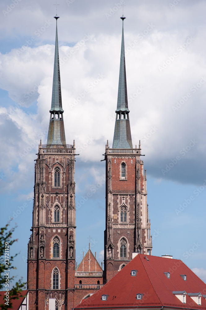 Gothic church towers against blue sky