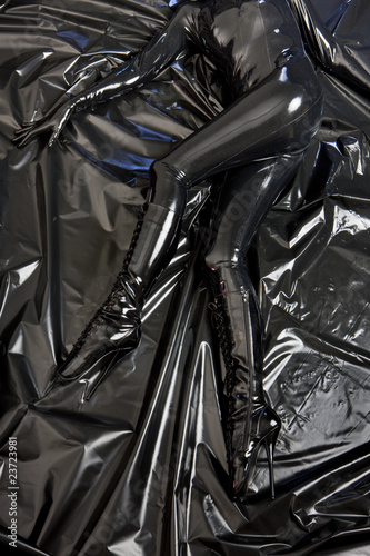 detail of lying woman in latex photo