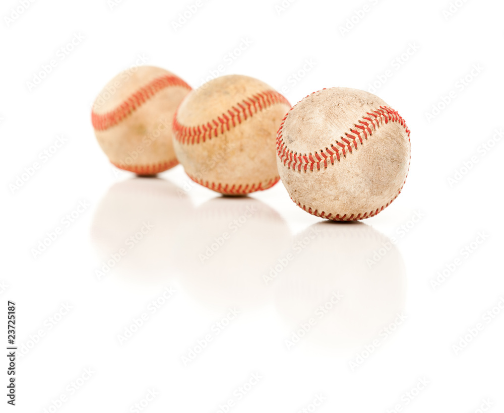 Three Baseballs Isolated on Reflective White Three Baseballs Isolated on Reflective White