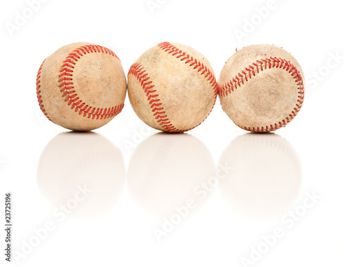 Three Baseballs Isolated on Reflective White