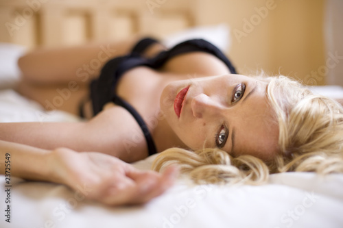 sexy blond girl on the bed
