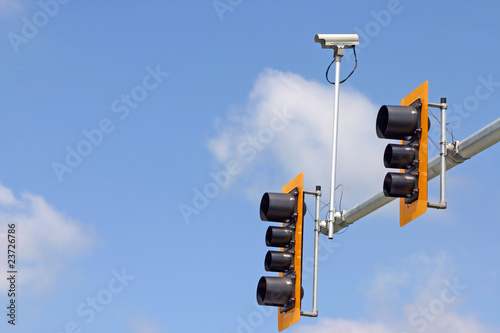 Secure camera with traffic light and sign.