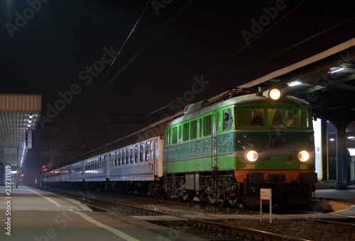 Passenger train waiting at the station platform during the night