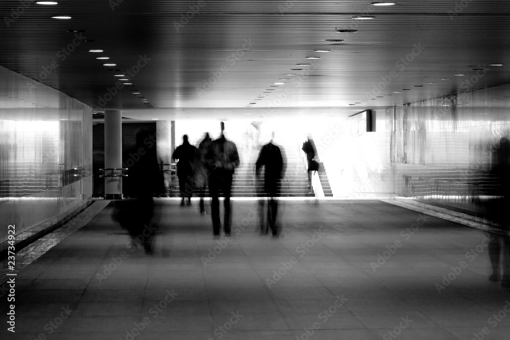 motion blurred of people walking in subway