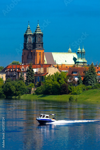 River, motorboat and a cathedral church