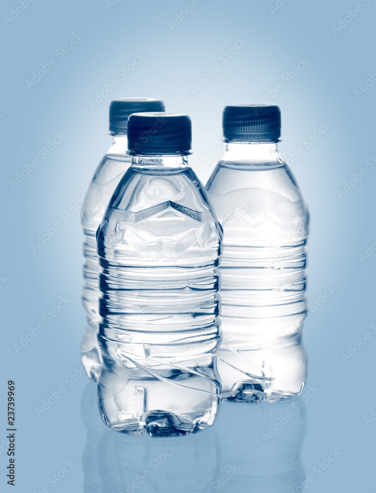 purified spring mineral water in the bottles with reflection purified spring mineral water in the bottles with reflection
