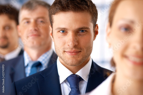 Closeup of Businessman With Colleagues.