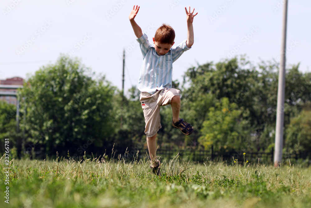 little boy runs in a summer park little boy runs in a summer park
