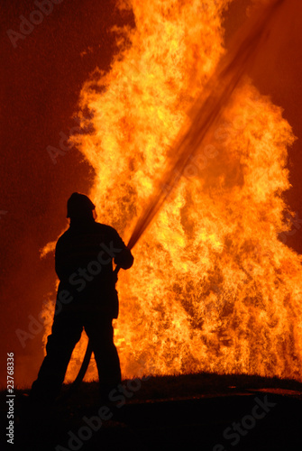 lone fireman battling against raging fire