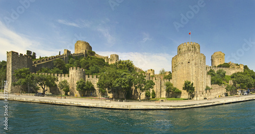 Ancient fortress on a large river photo