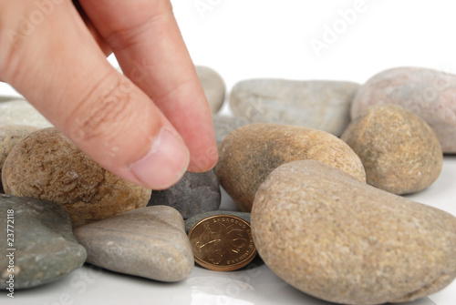 coin in stones