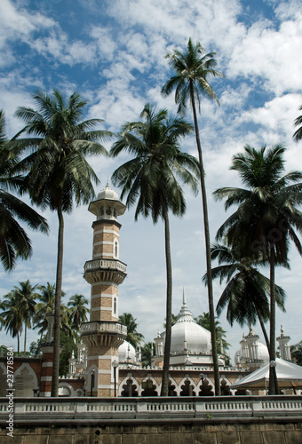 Muslim mosque and palm trees in Kuala Lumpur