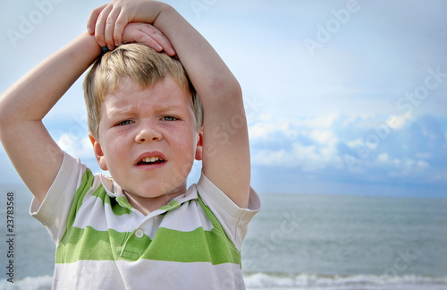 Boy at sunny beach