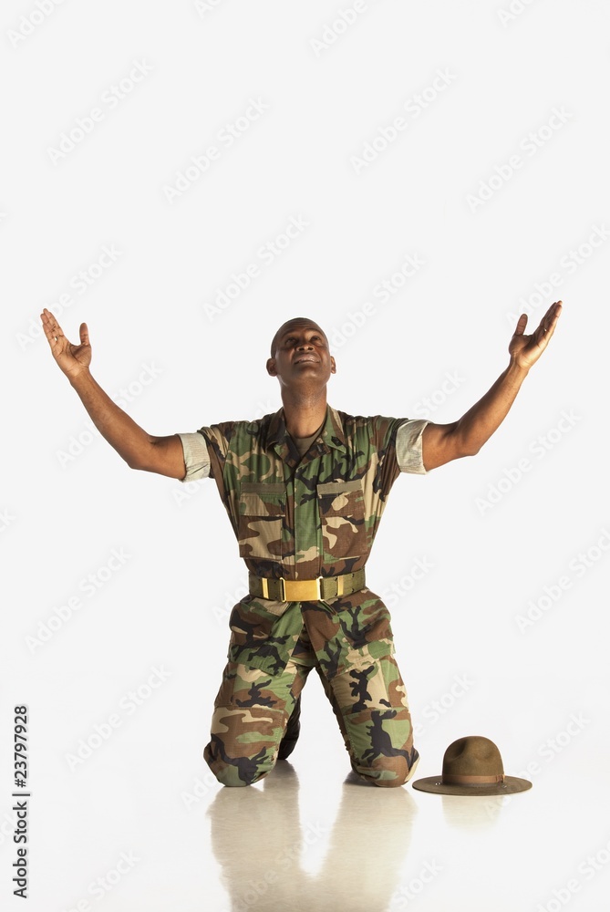 A Military Man With Arms In The Air And Looking Upwards A Military Man With Arms In The Air And Looking Upwards
