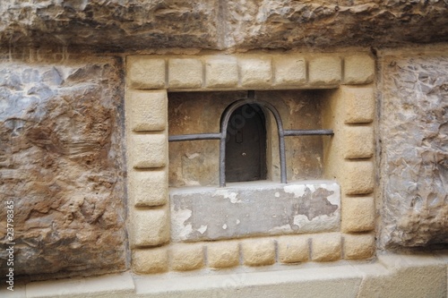 A Miniature Door In A Stone Wall