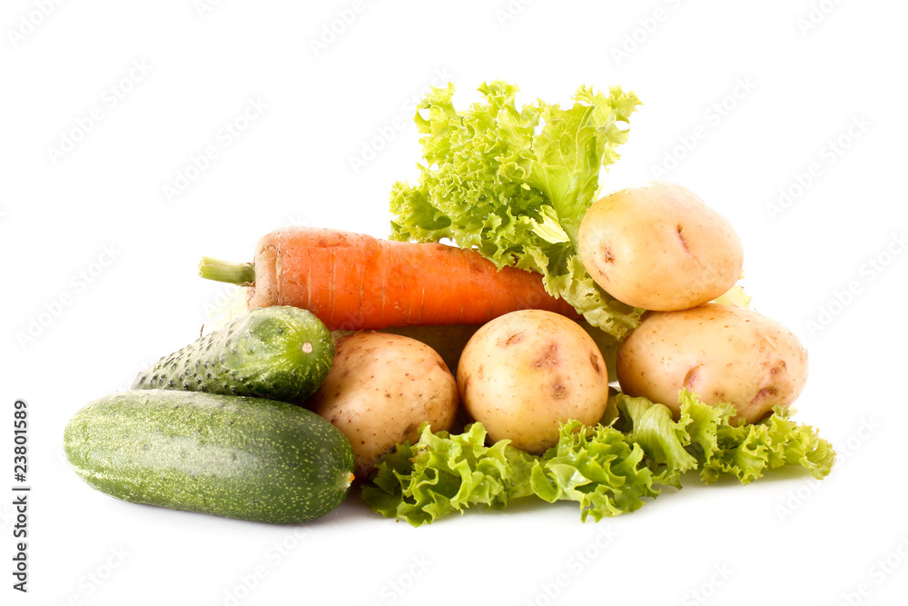 Green salad, potatoes, cucumbers and carrots isolated on white