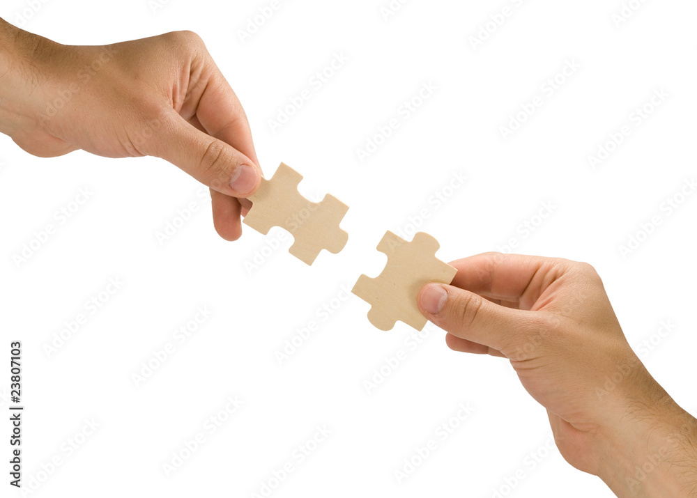 hands with pieces of puzzle on white background hands with pieces of puzzle on white background