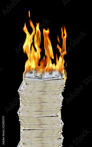 a pile of 10 dollar bills on fire