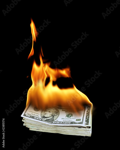 a pile of 10 dollar bills on fire
