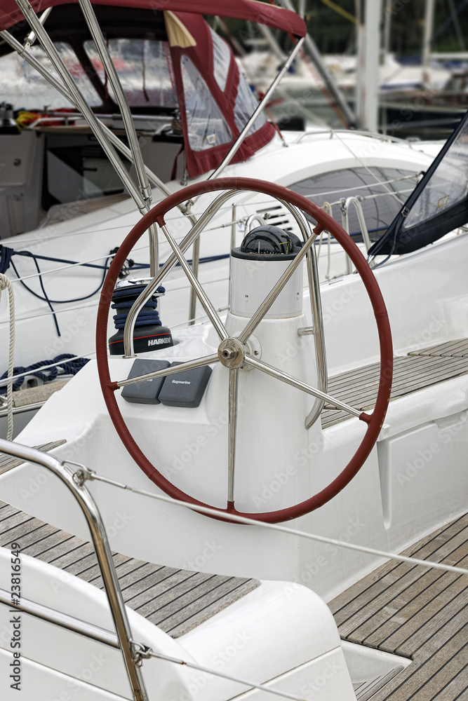 Rudder wheel and compass of a sailboat in Cala d'Or