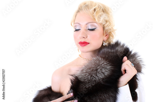 Blondie woman with fur collar dreaming. Marilyn Monroe imitation