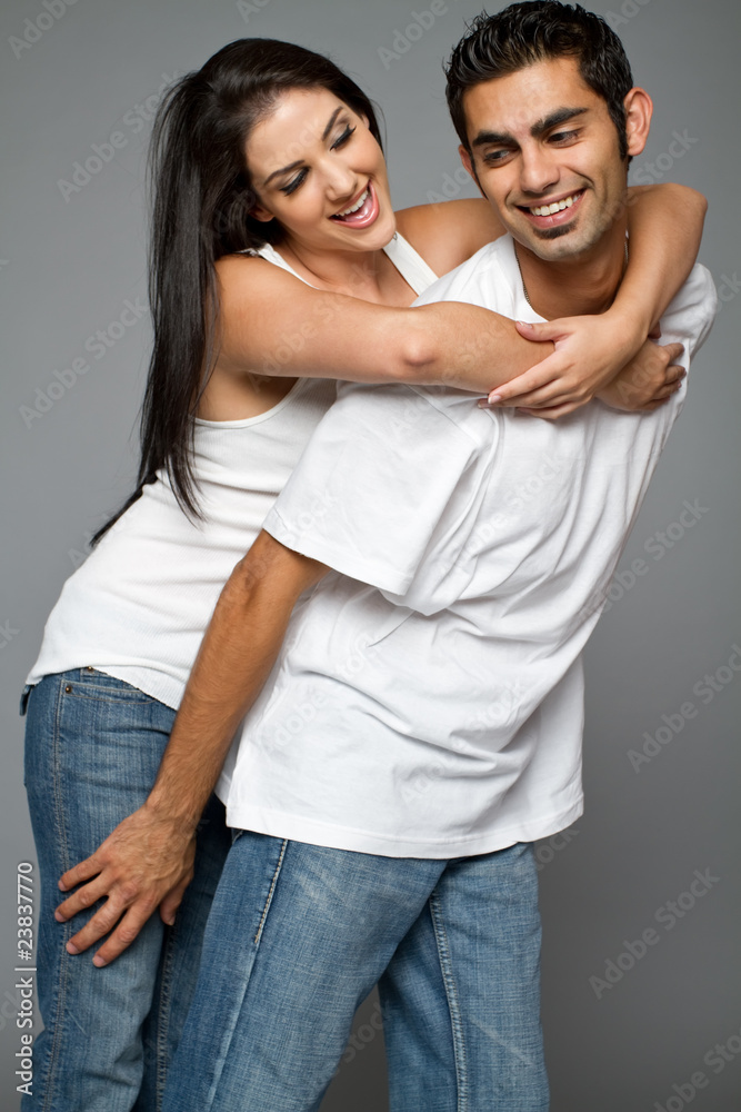Young happy ethnic couple