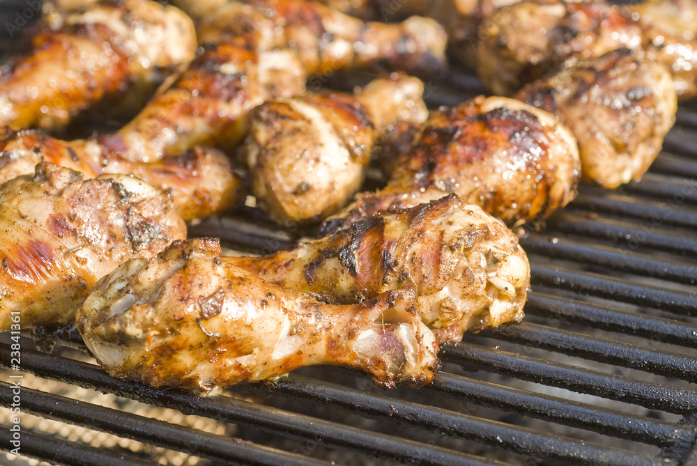 Jerk Chicken Drumsticks Cooking on the Barbecue Grill